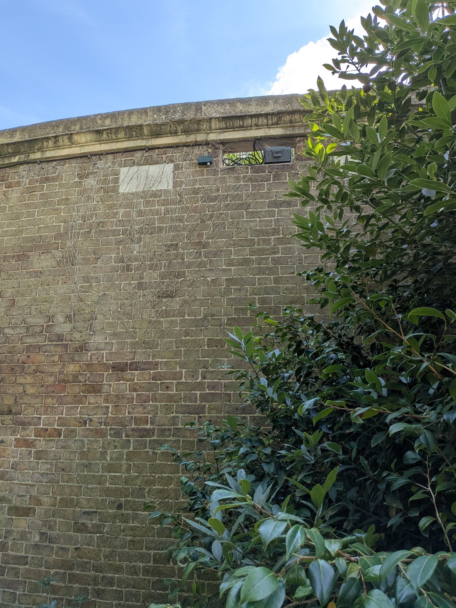 The Alauda listening post tucked into a recess at the top of the brick garden wall